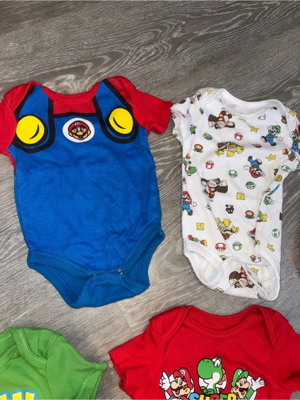 Super Mario baby onesies